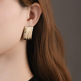 Caelynn Gold Wave Statement Earrings