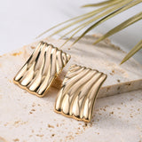Caelynn Gold Wave Statement Earrings