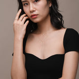 Model wearing freshwater pearl and diamond solid gold jewellery