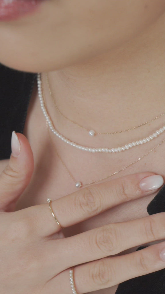 Video of model wearing dainty freshwater pearl and solid gold jewellery
