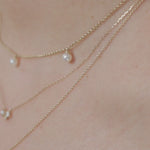  Layered freshwater pearl and solid gold necklaces