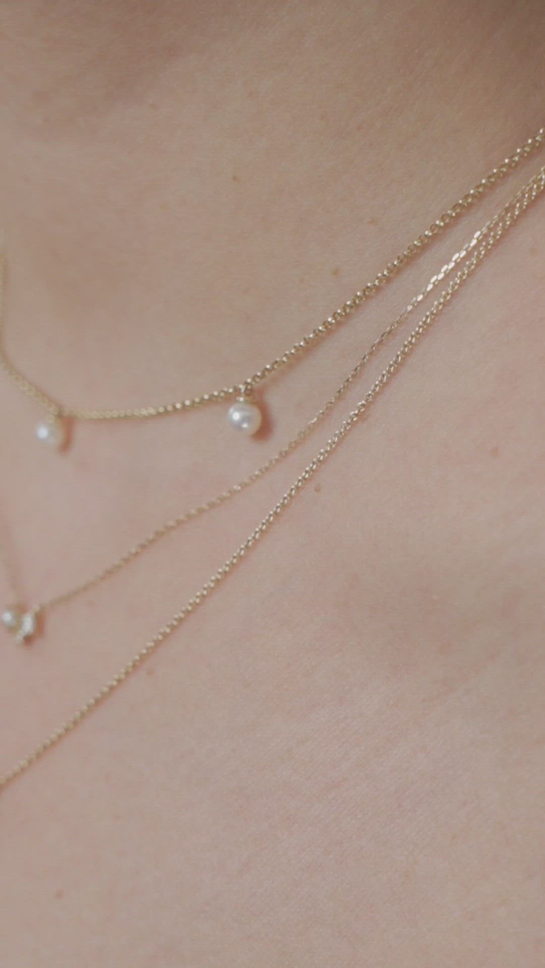  Layered freshwater pearl and solid gold necklaces