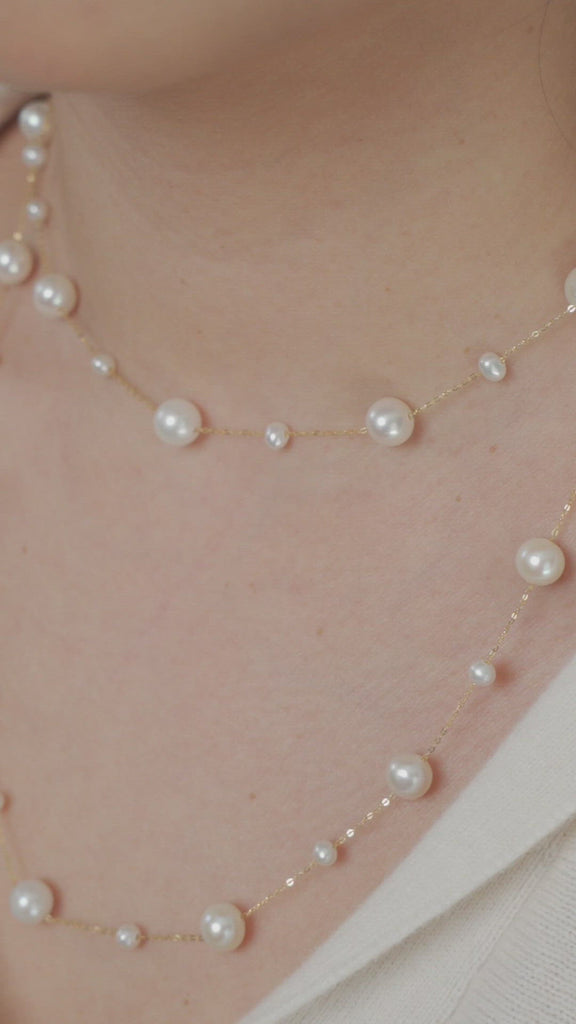 Video of model wearing long freshwater pearl and solid gold necklace