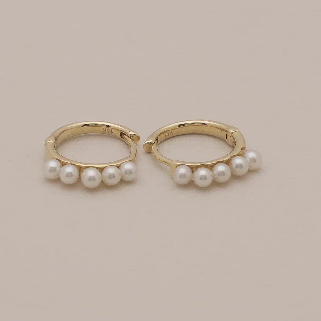 Video of mini freshwater pearl and solid gold huggies earring
