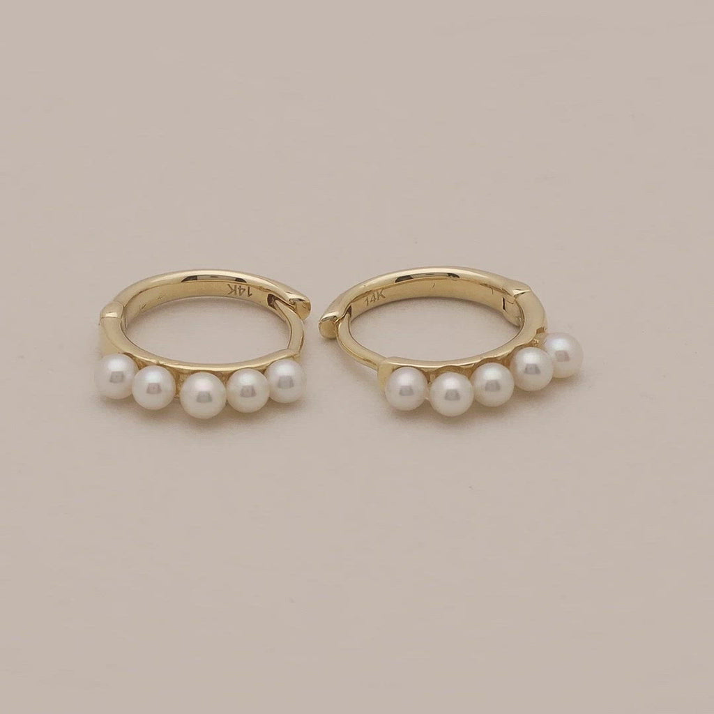 Video of mini freshwater pearl and solid gold huggies earring