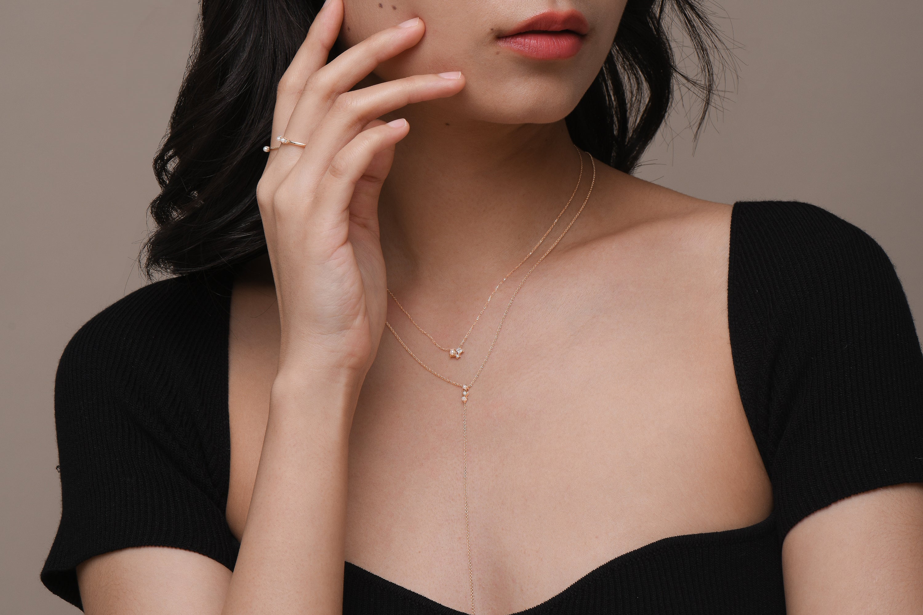 Model wearing dainty freshwater pearl and diamond jewellery