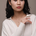 Model wearing freshwater pearl and solid gold jewellery