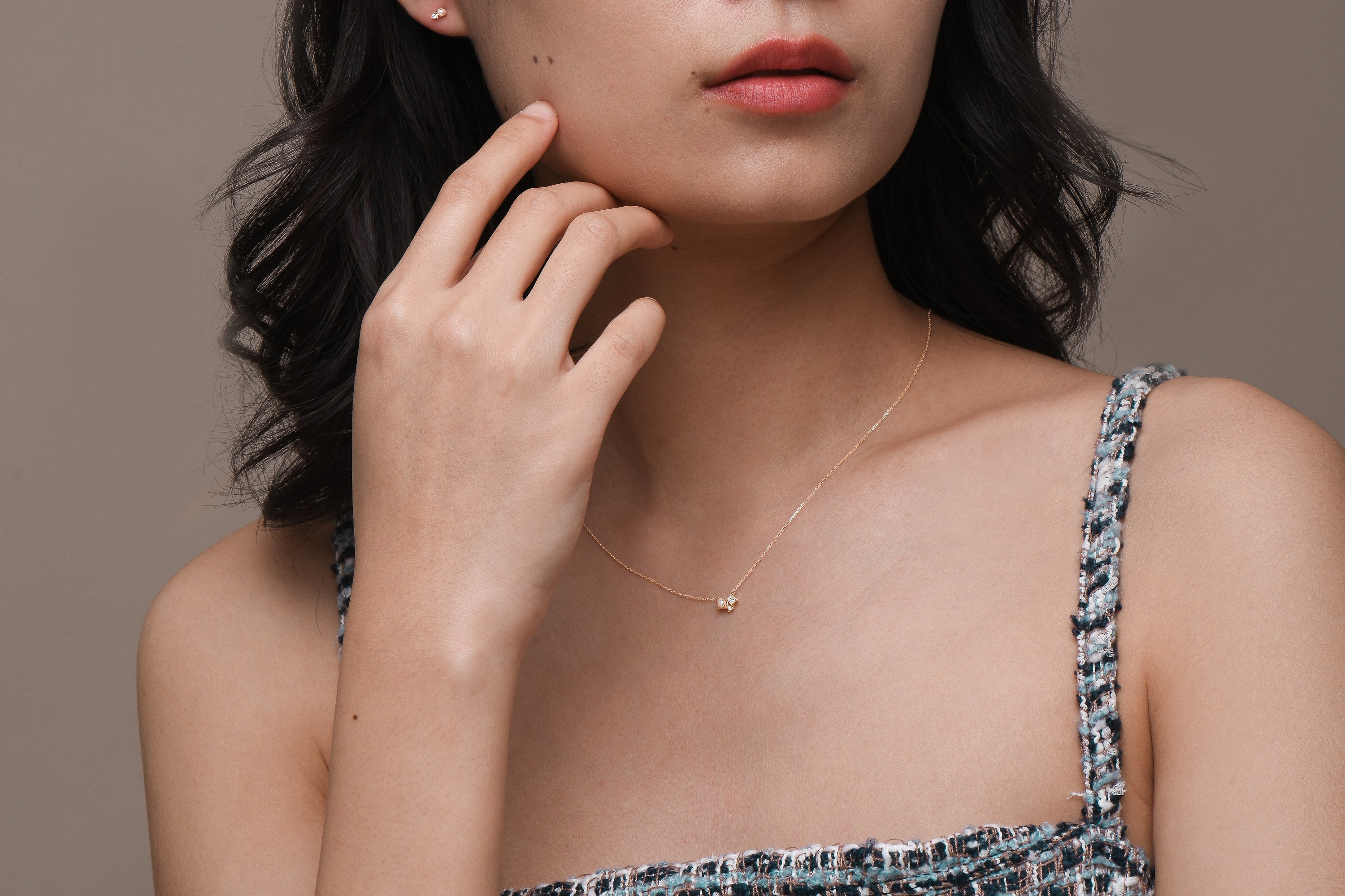Model wearing freshwater pearl and solid gold jewellery