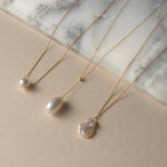 Three freshwater pearl and solid gold necklace