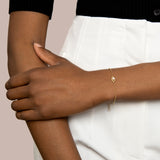 Evil eye solid gold and freshwater pearl bracelet