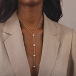 Model wearing Freshwater pearl and solid gold lariat necklace