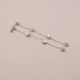 Video of long dangling freshwater pearl and solid gold earring