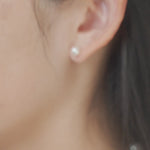 Video of model wearing freshwater pearl and solid gold earrings
